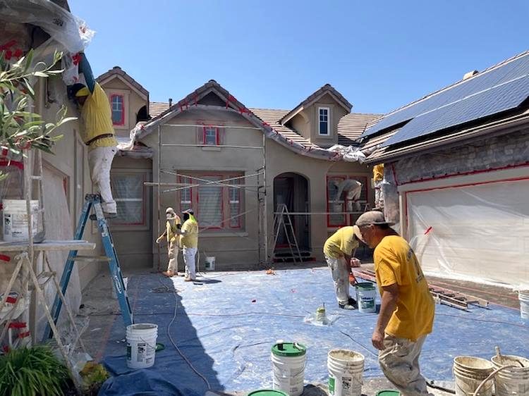 Lemon Grove Stucco crew re-stuccoing a house